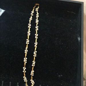 Gold tone and faux pearl necklace